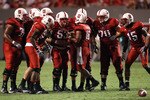 RALEIGH, NC - SEPTEMBER 16:  Russell Wilson #16 of the North Carolina State Wolfpack talks to his team in the huddle against the Cincinnati Bearcats during their game at Carter-Finley Stadium on September 16, 2010 in Raleigh, North Carolina.  (Photo by Streeter Lecka/Getty Images)