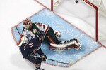 EDMONTON, CANADA - MARCH 5:  Mike Comrie #91of the Edmonton Oilers scores the game winner in a shootout on Niklas Backstrom #32of the Minnesota Wild.  Edmonton won the game 2-1 on March 5, 2010 at the Rexall Place in Edmonton, Alberta, Canada. (Photo by Dale MacMillan/Getty Images)