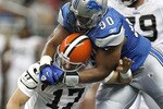 DETROIT - AUGUST 28:  Ndamukong Suh #90 of the Detroit Lions tackles Jake Delhomme #17 of the Cleveland Browns during a preseason game on August 28, 2010 at Ford Field in Detroit, Michigan. Suh was called for a personal foul on the play for grabbing the face mask. (Photo by Gregory Shamus/Getty Images)