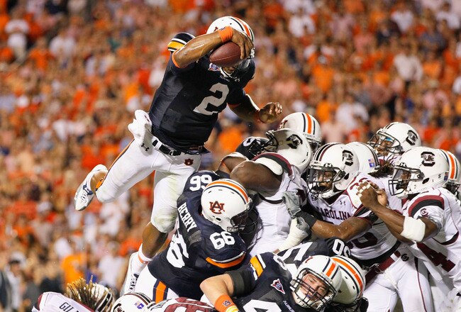 AUBURN, AL - SEPTEMBER 25:  Quarterback Cameron Newton #2 of the Auburn Tigers dives across the offensive and defensive lines for a touchdown against the South Carolina Gamecocks before it was called back for a false start at Jordan-Hare Stadium on September 25, 2010 in Auburn, Alabama.  (Photo by Kevin C. Cox/Getty Images)