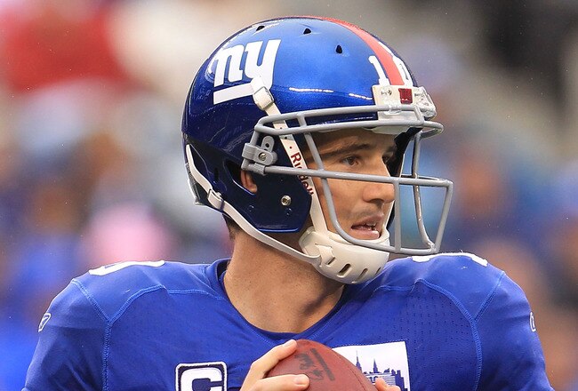 EAST RUTHERFORD, NJ - SEPTEMBER 12:  Eli Manning #10 of the New York Giants looks to pass  against the Carolina Panthers during the NFL season opener at New Meadowlands Stadium on September 12, 2010 in East Rutherford, New Jersey.  (Photo by Chris McGrath/Getty Images)