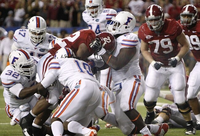 ATLANTA - DECEMBER 5:  Mark Ingram #22 of the Alabama Crimson Tide scores a 1-yard rushing touchdown in the fourth quarter against the Florida Gators during the SEC Championship game at Georgia Dome on December 5, 2009 in Atlanta, Georgia. It was Ingrams 3rd touchdown on the day. (Photo by Chris Graythen/Getty Images)
