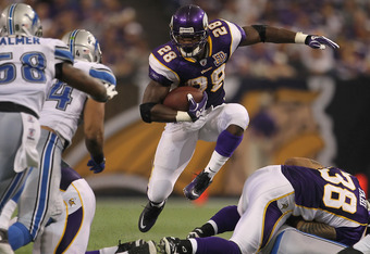 MINNEAPOLIS - SEPTEMBER 26:  Running back Adrian Peterson #28 of the Minnesota Vikings jumps through a hole while carrying the ball against the Detroit Lions during the second half at Hubert H. Humphrey Metrodome on September 26, 2010 in Minneapolis, Minnesota. The Vikings defeated the Lions 24-10.  (Photo by Jeff Gross/Getty Images)