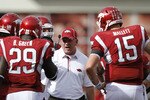 FAYETTEVILLE - SEPTEMBER 25: Arkansas Razorbacks head coach Bobby Petrino (C) talks to his players during the game against the Alabama Crimson Tide at Donald W. Reynolds Razorback Stadium on September 25, 2010 in Fayetteville, Arkansas. Alabama won 24-20. (Photo by Joe Robbins/Getty Images)