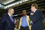 Detroit Lions owner William Clay Ford (left) and vice chairman William Clay Ford Jr. (right) talk wih Barry Sanders before play  against the Indianapolis Colts in a Thanksgiving Day game, November 25, 2005 in Detroit.  The Colts defeated the Lions 41 to 9.  (Photo by Al Messerschmidt/Getty Images)