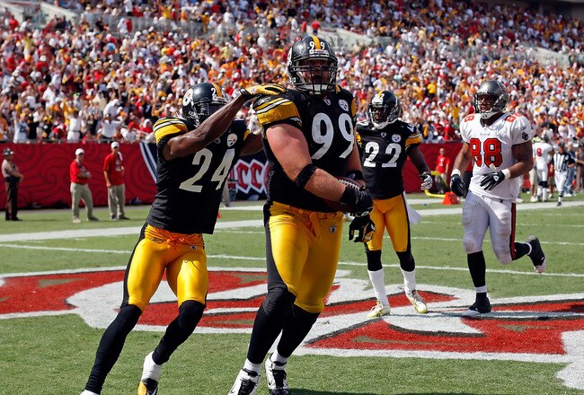TAMPA, FL - SEPTEMBER 26:  Defensive end Brett Keisel #99 of the Pittsburgh Steelers scores a touchdown after incepting a pass against the Tampa Bay Buccaneers during the game at Raymond James Stadium on September 26, 2010 in Tampa, Florida. The undefeated Steelers won 38-13.  (Photo by J. Meric/Getty Images)