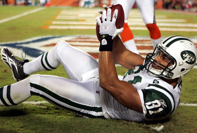 MIAMI - SEPTEMBER 26:  Tight end Dustin Keller #81  of the New York Jets catches a touchdown against  the Miami Dolphins at Sun Life Stadium on September 26, 2010 in Miami, Florida.  (Photo by Marc Serota/Getty Images)