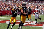 TAMPA, FL - SEPTEMBER 26:  Defensive end Brett Keisel #99 of the Pittsburgh Steelers scores a touchdown after incepting a pass against the Tampa Bay Buccaneers during the game at Raymond James Stadium on September 26, 2010 in Tampa, Florida. The undefeated Steelers won 38-13.  (Photo by J. Meric/Getty Images)