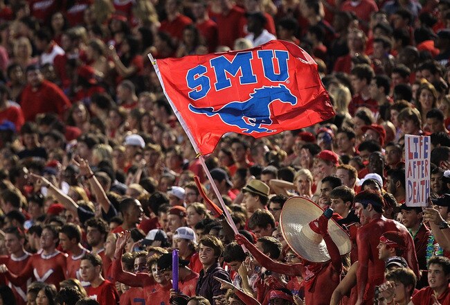DALLAS - SEPTEMBER 24:  Fans of the SMU Mustangs wave a flag during play against the TCU Horned Frogs at Gerald J. Ford Stadium on September 24, 2010 in Dallas, Texas.  (Photo by Ronald Martinez/Getty Images)