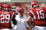 FAYETTEVILLE - SEPTEMBER 25: Arkansas Razorbacks head coach Bobby Petrino (C) talks to his players during the game against the Alabama Crimson Tide at Donald W. Reynolds Razorback Stadium on September 25, 2010 in Fayetteville, Arkansas. Alabama won 24-20. (Photo by Joe Robbins/Getty Images)