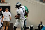 JACKSONVILLE, FL - SEPTEMBER 26:  Quarterback Michael Vick #7 of the Philadelphia Eagles runs for a touchdown past safety Courtney Greene #36 of the Jacksonville Jaguars at EverBank Field on September 26, 2010 in Jacksonville, Florida. The Eagles defeated the Jaguars 28-3.  (Photo by Doug Benc/Getty Images)