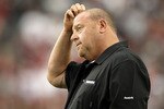 GLENDALE, AZ - SEPTEMBER 26:  Head coach Tom Cable of the Oakland Raiders scratches his head as he stands on the sidelines during the fourth quarter of the NFL game against the Arizona Cardinals at the University of Phoenix Stadium on September 26, 2010 in Glendale, Arizona.  The Cardinals defeated the Raiders 24-23. (Photo by Christian Petersen/Getty Images)
