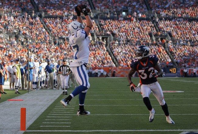 DENVER - SEPTEMBER 26:  Wide receiver Austin Collie #17 of the Indianapolis Colts makes a 23 yard touchdown reception in the fourth quarter as Perrish Cox #32 of the Denver Broncos defends at INVESCO Field at Mile High on September 26, 2010 in Denver, Colorado. The Colts defeated the Broncos 27-13.  (Photo by Doug Pensinger/Getty Images)