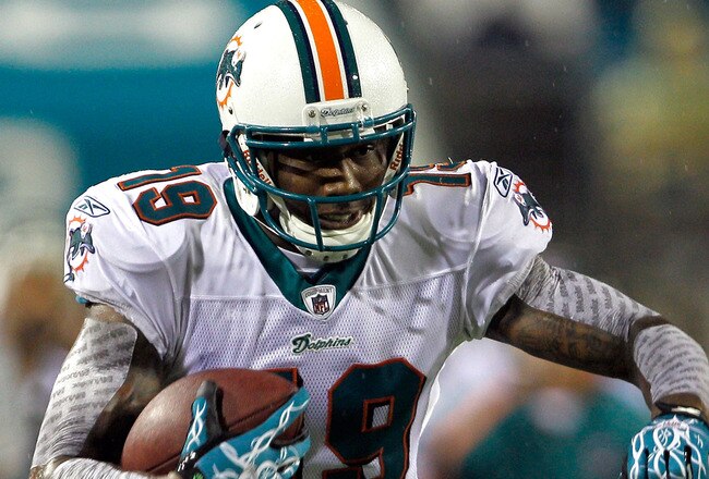 JACKSONVILLE, FL - AUGUST 21:  Brandon Marshall #19 of the Miami Dolphins runs after making a reception during the preseason game against the Jacksonville Jaguars at EverBank Field on August 21, 2010 in Jacksonville, Florida.  (Photo by Sam Greenwood/Getty Images)