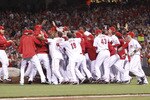 CINCINNATI, OH - SEPTEMBER 28: The Cincinnati Reds celebrate following the game against the Houston Astros at Great American Ball Park on September 28, 2010 in Cincinnati, Ohio. The Reds won 3-2 to clinch the NL Central Division title. (Photo by Joe Robbins/Getty Images)