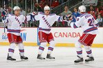 NEWARK, NJ - JANUARY 10:  Vinny Prospal #20 of the New York Rangers celebrates his first-period goal with teammates Marian Gaborik #10 and Michael del Zotto #4 during NHL action against the New Jersey Devils at the Prudential Center on March 10, 2010 in Newark, New Jersey. (Photo by Mike Stobe/Getty Images)