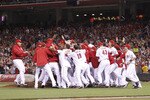 CINCINNATI, OH - SEPTEMBER 28: The Cincinnati Reds celebrate following the game against the Houston Astros at Great American Ball Park on September 28, 2010 in Cincinnati, Ohio. The Reds won 3-2 to clinch the NL Central Division title. (Photo by Joe Robbins/Getty Images)