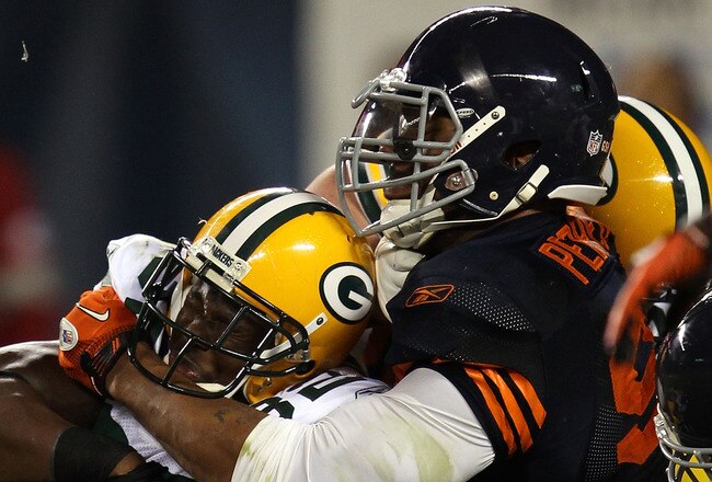CHICAGO - SEPTEMBER 27:  Julius Peppers #99 of the Chicago Bears tackles Brandon Jackson #32 of the Green Bay Packers at Soldier Field on September 27, 2010 in Chicago, Illinois.  (Photo by Jonathan Daniel/Getty Images)