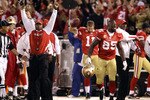 SAN FRANCISCO - SEPTEMBER 20:  Vernon Davis #85 and head coach Mike Singletary of the San Francisco 49ers celebrate a two-point conversion ruling was reversed in their favor due to instant replay during their game against the New Orleans Saints at Candlestick Park on September 20, 2010 in San Francisco, California.  (Photo by Ezra Shaw/Getty Images)