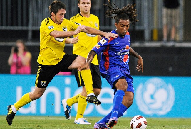 COLUMBUS, OH - AUGUST 18:  Danny O'Rourke #5 of the Columbus Crew battles with Guillermo Ramirez #11 of C.S.D. Municipal of Guatemala for control of the ball on August 18, 2010 at Crew Stadium in Columbus, Ohio.  (Photo by Jamie Sabau/Getty Images)