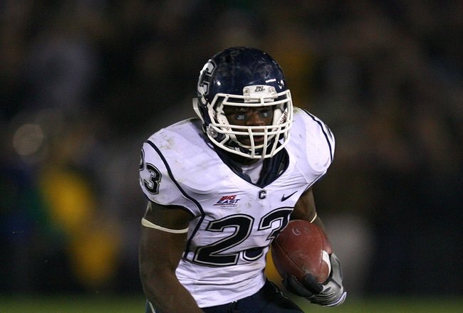 SOUTH BEND, IN - NOVEMBER 21: Jordan Todman #23 of the Univeristy of Connecticut Huskies runs with the ball against the Notre Dame Fighting Irish at Notre Dame Stadium on November 21, 2009 in South Bend, Indiana. Connecticut defeated Notre Dame 33-30 in overtime. (Photo by Jonathan Daniel/Getty Images)