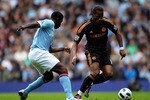 MANCHESTER, ENGLAND - SEPTEMBER 25:  Didier Drogba of Chelsea competes with Kolo Toure of Manchester City during the Barclays Premier League match between Manchester City and Chelsea at the City of Manchester Stadium on September 25, 2010 in Manchester, England. (Photo by Alex Livesey/Getty Images)