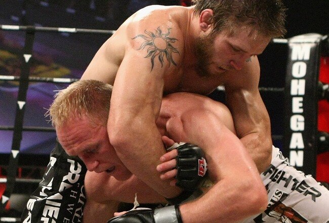 UNCASVILLE, CT - MAY 16:  Ryan Schultz (Black Trunks) of Team Quest Fight Club battles Deividas Taurosevicius of Renzo Gracie Jiu-Jitsu during their bout presented by the International Fighting League at the Mohegan Sun Arena May 16, 2008 in Uncasville, Connecticut.  (Photo by Al Bello/Getty Images)