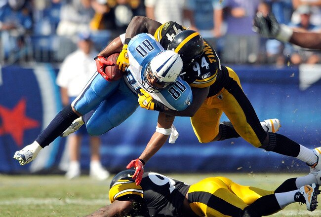 NASHVILLE, TN - SEPTEMBER 19:  Lawrence Timmons #94 of the Pittsburgh Steelers tackles Bo Scaife #80 of the Tennessee Titans at LP Field on September 19, 2010 in Nashville, Tennessee. The Steelers won 19-11.  (Photo by Grant Halverson/Getty Images)