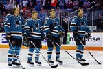 SAN JOSE, CA - SEPTEMBER 25: Douglas Murray #3, Joe Pavelski #8, Patrick Marleau #12, and Dany Heatley #15 of the San Jose Sharks stop for the national anthem before a preseason split-squad game against the Phoenix Coyotes at HP Pavilion on September 25, 2010 in San Jose, California.  The Sharks won 3-1.  (Photo by Brian Bahr/Getty Images)