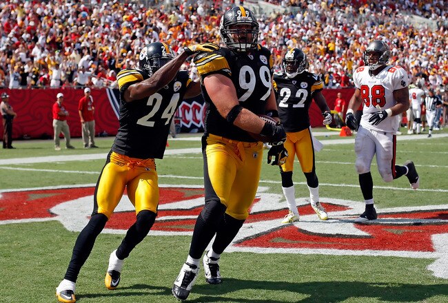 TAMPA, FL - SEPTEMBER 26:  Defensive end Brett Keisel #99 of the Pittsburgh Steelers scores a touchdown after incepting a pass against the Tampa Bay Buccaneers during the game at Raymond James Stadium on September 26, 2010 in Tampa, Florida. The undefeated Steelers won 38-13.  (Photo by J. Meric/Getty Images)