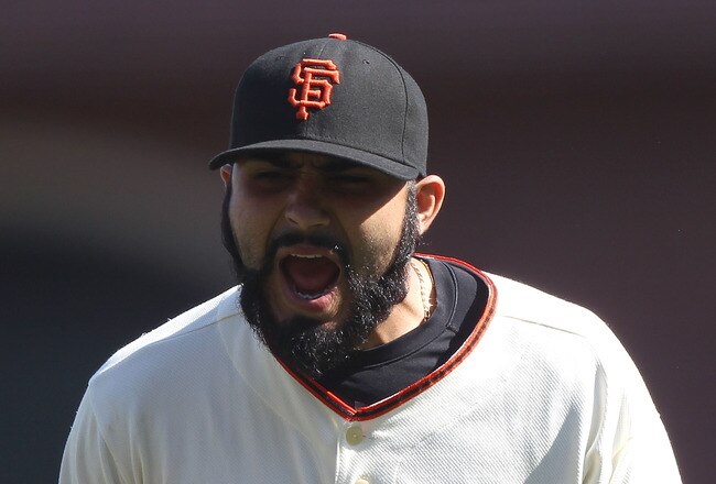 SAN FRANCISCO - SEPTEMBER 30:  Sergio Romo #54 of the San Francisco Giants celebrates after striking out Miguel Montero of the Arizona Diamondbacks in the eighth innng during a Major League Baseball game at AT&T Park on September 30, 2010 in San Francisco, California. (Photo by Jed Jacobsohn/Getty Images)
