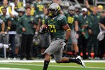 EUGENE, OR - SEPTEMBER 18: Running back LaMichael James #21of the Oregon Ducks heads to the end zone for a touchdown in the first quarter of the game against the Portland State Vikings at Autzen Stadium on September 18, 2010 in Eugene, Oregon. Oregon won the game 69-0.  (Photo by Steve Dykes/Getty Images)