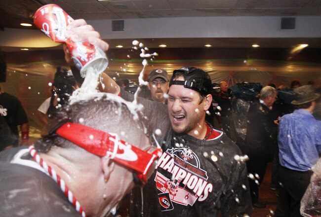 CINCINNATI, OH - SEPTEMBER 28: Paul Janish (R) and Jonny Gomes of the Cincinnati Reds celebrate following the game against the Houston Astros at Great American Ball Park on September 28, 2010 in Cincinnati, Ohio. The Reds won 3-2 to clinch the NL Central Division title. (Photo by Joe Robbins/Getty Images)