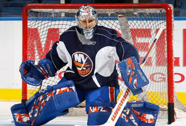 UNIONDALE, NY - SEPTEMBER 21: Rick DiPietro #39 of the New York Islanders defends the net during a training camp session on September 21, 2010 at Nassau Coliseum in Uniondale.  (Photo by Mike Stobe/Getty Images)
