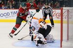 ST PAUL, MN - SEPTEMBER 25:  Goaltender Sergei Bobrovsky #35 of the Philadelphia Flyers pokes the puck away from Casey Wellman #17 of the Minnesota Wild during the shootout at Xcel Energy Center on September 25, 2010 in St Paul, Minnesota. The Flyers defeated the Wild 3-2 in a shootout.  (Photo by Jeff Gross/Getty Images)