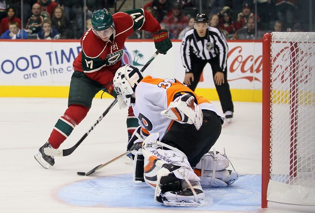 ST PAUL, MN - SEPTEMBER 25:  Goaltender Sergei Bobrovsky #35 of the Philadelphia Flyers pokes the puck away from Casey Wellman #17 of the Minnesota Wild during the shootout at Xcel Energy Center on September 25, 2010 in St Paul, Minnesota. The Flyers defeated the Wild 3-2 in a shootout.  (Photo by Jeff Gross/Getty Images)