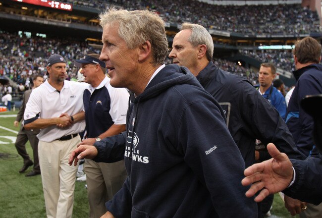 SEATTLE - SEPTEMBER 26:  Head coach Pete Carroll of the Seattle Seahawks heads off the field after defeating the San Diego Chargers 27-10 at Qwest Field on September 26, 2010 in Seattle, Washington. (Photo by Otto Greule Jr/Getty Images)