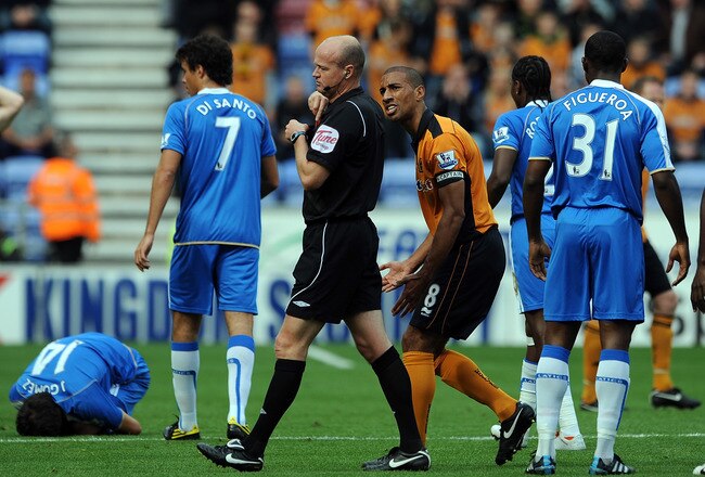 WIGAN, ENGLAND - OCTOBER 02:  Karl Henry of Wolverhampton Wanderers complains to referee Lee Mason after being sent-off during the Barclays Premier League match between Wigan Athletic and Wolverhampton Wanderers at DW Stadium on October 2, 2010 in Wigan, England.  (Photo by Chris Brunskill/Getty Images)