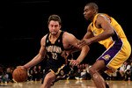 LOS ANGELES - MARCH 2:  Josh McRoberts #32 of the Indiana Pacers drives around Andrew Bynum #16 of the Los Angeles Lakers on March 2, 2010 at Staples Center in Los Angeles, California. The Lakers won 122-99.  NOTE TO USER: User expressly acknowledges and agrees that, by downloading and/or using this Photograph, user is consenting to the terms and conditions of the Getty Images License Agreement. (Photo by Stephen Dunn/Getty Images)