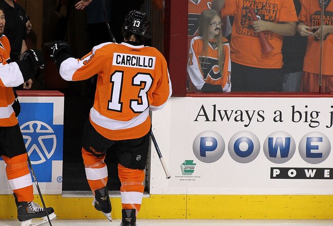 PHILADELPHIA - JUNE 02:  Arron Asham #45 and Daniel Carcillo #13 of the Philadelphia Flyers exit the ice during warm-ups before Game Three of the 2010 NHL Stanley Cup Final against the the Chicago Blackhawks at Wachovia Center on June 2, 2010 in Philadelphia, Pennsylvania.  (Photo by Andre Ringuette/Getty Images)
