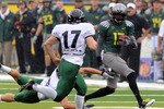 EUGENE, OR - SEPTEMBER 18: Cornerback Cliff Harris #13 of the Oregon Ducks returns a punt as punter Robert Truax #17 of the Portland State Vikings closes in during the first quarter of the game at Autzen Stadium on September 18, 2010 in Eugene, Oregon. Oregon won the game 69-0.  (Photo by Steve Dykes/Getty Images)
