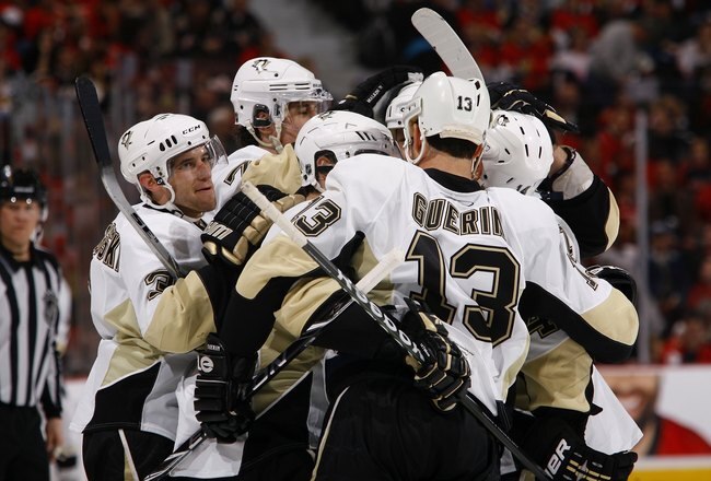 OTTAWA, ON - APRIL 18:  Alex Goligoski #3, Evgeni Malkin #71, Sidney Crosby #87,  Bill Guerin #13 and Chris Kunitz #14 of the Pittsburgh Penguins celebrate against the Ottawa Senators during Game 3 of the Eastern Conference Quaterfinals during the 2010 Stanley Cup Playoffs at Scotiabank Place on April 18, 2010 in Ottawa, Canada.  (Photo by Phillip MacCallum/Getty Images)
