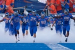 BOISE, ID - SEPTEMBER 25:  Linebacker Billy Derome #25 of the Boise State Broncos leads his team onto the field before the game against the Oregon State Beavers at Bronco Stadium on September 25, 2010 in Boise, Idaho.  (Photo by Otto Kitsinger III/Getty Images)