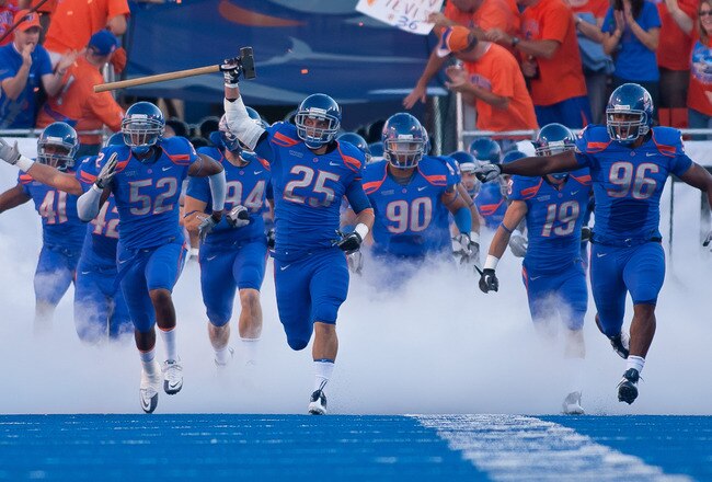 BOISE, ID - SEPTEMBER 25:  Linebacker Billy Derome #25 of the Boise State Broncos leads his team onto the field before the game against the Oregon State Beavers at Bronco Stadium on September 25, 2010 in Boise, Idaho.  (Photo by Otto Kitsinger III/Getty Images)