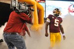 LANDOVER - SEPTEMBER 12:  Donovan McNabb #5 of the Washington Redskins prepares to run onto the field before the NFL season opener against the Dallas Cowboys at FedExField on September 12, 2010 in Landover, Maryland. The Redskins defeated the Cowboys 13-7. (Photo by Larry French/Getty Images)