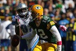GREEN BAY, WI - OCTOBER 03: Aaron Rodgers #12 of the Green Bay Packers moves to avoid Cliff Avril #92 of the Detroit Lions at Lambeau Field on October 3, 2010 in Green Bay, Wisconsin. (Photo by Jonathan Daniel/Getty Images)