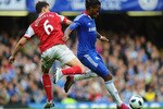 LONDON, ENGLAND - OCTOBER 03:  Didier Drogba of Chelsea is challenged by Laurent Koscielny of Arsenal during the Barclays Premier League match between Chelsea and Arsenal at Stamford Bridge on October 3, 2010 in London, England.  (Photo by Mike Hewitt/Getty Images)