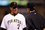 PITTSBURGH - AUGUST 25:  Manager John Russell #7 of the Pittsburgh Pirates argues a home run call with umpire Chris Guccione during the game against the St. Louis Cardinals on August 25, 2010 at PNC Park in Pittsburgh, Pennsylvania.  (Photo by Jared Wickerham/Getty Images)