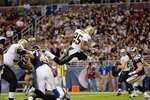 ST. LOUIS - NOVEMBER 15:  Reggie Bush #25 of the New Orleans Saints leaps for the endzone during the game against the St. Louis Rams at the Edward Jones Dome on November 15, 2009 in St. Louis, Missouri.  (Photo by Dilip Vishwanat/Getty Images)