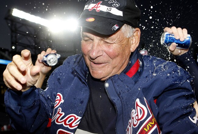 ATLANTA - OCTOBER 03:  Manager Bobby Cox #6 of the Atlanta Braves is doused by beer during the on-field playoff celebration after the game against the Philadelphia Phillies at Turner Field on October 3, 2010 in Atlanta, Georgia.  The Braves beat the Phillies 8-7.  (Photo by Mike Zarrilli/Getty Images)